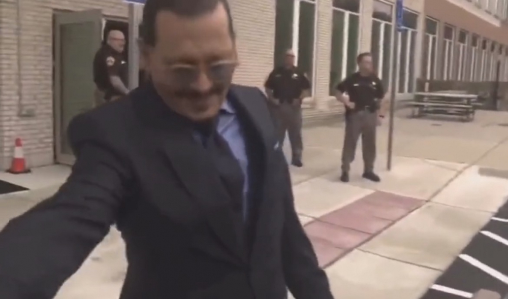 Depp shakes hands with every official at court